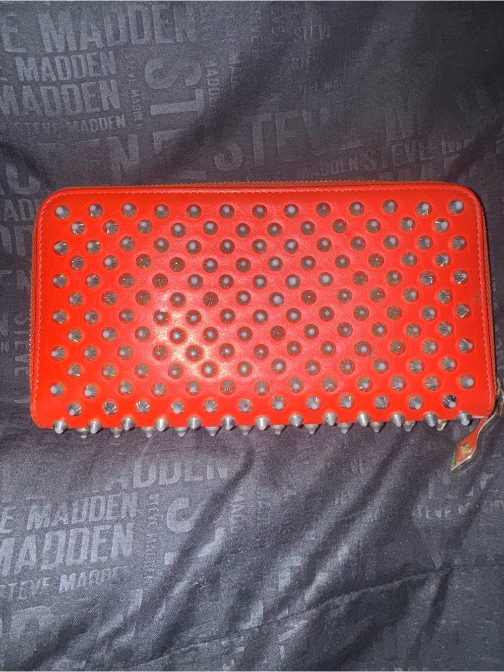 Christian Louboutin spiked red zip long wallet.